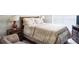 Cozy bedroom with a well-made bed, wooden nightstand, and lamps for a warm and inviting space at 2407 Cove Lake Way, Lithonia, GA 30058