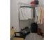 Organized walk-in closet with shelving and hanging rods filled with clothing and shoes at 2407 Cove Lake Way, Lithonia, GA 30058