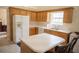 Well-lit kitchen with wooden cabinets, white countertops, and modern appliances, including an island with seating at 2407 Cove Lake Way, Lithonia, GA 30058
