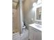 Bathroom with white cabinets, white shower, and a patterned tile floor at 3254 Howell Cir, Duluth, GA 30096