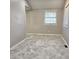 Bedroom with tile floor and neutral paint with lots of light coming from large windows at 3254 Howell Cir, Duluth, GA 30096