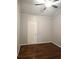 Bedroom featuring hardwood floors, neutral paint, and a ceiling fan at 3254 Howell Cir, Duluth, GA 30096