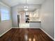 Open-concept kitchen and dining room with new stainless steel appliances and tile floors at 3254 Howell Cir, Duluth, GA 30096