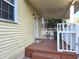 Covered front porch with white railings and small stoop provides a welcoming entrance at 3254 Howell Cir, Duluth, GA 30096