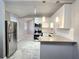 Modern kitchen features stainless steel appliances, granite countertops and stylish tile floors at 3254 Howell Cir, Duluth, GA 30096