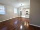 Bright living room with hardwood floors next to an updated kitchen with stainless steel appliances at 3254 Howell Cir, Duluth, GA 30096