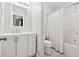 Bright bathroom featuring a vanity, toilet, and shower with tile surround at 3569 Tupelo Trl, Auburn, GA 30011