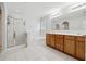 Bright bathroom features a separate shower, soaking tub, double vanity, and neutral paint at 3569 Tupelo Trl, Auburn, GA 30011