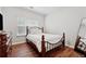 Cozy bedroom with a comfortable bed, wooden accents, and plenty of natural light at 3569 Tupelo Trl, Auburn, GA 30011