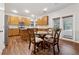 Eat-in kitchen featuring wood cabinets, stainless appliances, and granite countertops at 3569 Tupelo Trl, Auburn, GA 30011