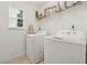 Functional laundry room with modern washer and dryer at 3569 Tupelo Trl, Auburn, GA 30011
