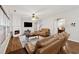 Inviting living room with fireplace, hardwood floors, and plenty of natural light at 3569 Tupelo Trl, Auburn, GA 30011