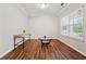 Small office space with hardwood floors, bright window, and light gray walls at 3569 Tupelo Trl, Auburn, GA 30011