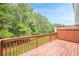 Wooden deck with railing overlooking yard and trees at 5589 Trace Views Dr, Norcross, GA 30071