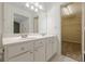Bright bathroom features double sink vanity and walk-in closet at 5589 Trace Views Dr, Norcross, GA 30071