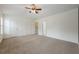 Spacious bedroom with neutral carpet, fan, and closet at 5589 Trace Views Dr, Norcross, GA 30071
