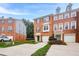 A well-maintained brick townhome featuring attached garages and landscaped front yards at 5589 Trace Views Dr, Norcross, GA 30071