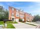 Attractive brick townhome exterior with attached garages and well-maintained front yard landscaping at 5589 Trace Views Dr, Norcross, GA 30071