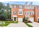 Charming brick townhome with manicured landscaping, attached garage, and inviting entryway at 5589 Trace Views Dr, Norcross, GA 30071