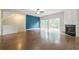 Spacious living room with fireplace, ceiling fan, and sliding glass doors to wooden deck and backyard at 5589 Trace Views Dr, Norcross, GA 30071