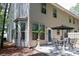 Backyard patio with dining set and lush surroundings, perfect for outdoor gatherings and relaxation at 1547 Paxton Sw Dr, Lilburn, GA 30047