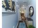 A view of the home's entry hallway with hardwood floors, decor, and modern light fixtures at 1547 Paxton Sw Dr, Lilburn, GA 30047