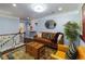 Bright living room featuring leather furniture, decor, and a decorative rug at 1547 Paxton Sw Dr, Lilburn, GA 30047