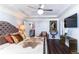 Spacious main bedroom with tray ceiling, hardwood floors, decor, and a sitting area at 1547 Paxton Sw Dr, Lilburn, GA 30047