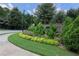 A charming street view of a home community with brick signage and lush landscaping at 1547 Paxton Sw Dr, Lilburn, GA 30047