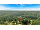 Overhead shot of the home's location amidst a lush green forest, showing its peaceful setting at 1731 Maryland Sw Ave, Marietta, GA 30008