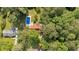 Aerial view showcases the property's layout with a pool, large yard, and surrounding mature trees, including neighboring homes at 1731 Maryland Sw Ave, Marietta, GA 30008