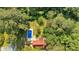 Aerial view of the property featuring a pool, house, and lush, mature trees at 1731 Maryland Sw Ave, Marietta, GA 30008