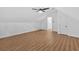 Finished attic boasts wood-look flooring and a ceiling fan at 1731 Maryland Sw Ave, Marietta, GA 30008