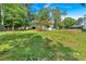 Lush backyard featuring mature trees, shed, and plenty of space for recreation, perfect for outdoor living at 1731 Maryland Sw Ave, Marietta, GA 30008