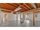 Unfinished basement area with painted cement floor and exposed ceiling with exposed beams ready for customization at 1731 Maryland Sw Ave, Marietta, GA 30008