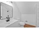 Upstairs bathroom with large mirror and tiled shower at 1731 Maryland Sw Ave, Marietta, GA 30008
