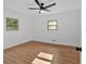 Bright bedroom features wood-look flooring and a modern ceiling fan at 1731 Maryland Sw Ave, Marietta, GA 30008