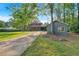 Long driveway leading to a charming home and a detached garage at 1731 Maryland Sw Ave, Marietta, GA 30008