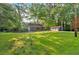 Expansive front yard with a well-maintained lawn and a detached three-car garage at 1731 Maryland Sw Ave, Marietta, GA 30008
