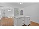 Eat-in kitchen featuring a kitchen island, white cabinets and stainless appliances at 1731 Maryland Sw Ave, Marietta, GA 30008