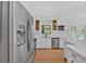 Bright kitchen featuring white cabinets, stainless steel appliances, and a center island at 1731 Maryland Sw Ave, Marietta, GA 30008