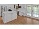 Bright kitchen with stainless steel appliances, a center island, and white cabinets at 1731 Maryland Sw Ave, Marietta, GA 30008