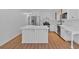 Modern kitchen with stainless steel appliances and a large center island at 1731 Maryland Sw Ave, Marietta, GA 30008