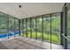 View from inside screened porch overlooking backyard with a pool and green surroundings, perfect for outdoor enjoyment at 1731 Maryland Sw Ave, Marietta, GA 30008