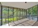 A bright screened porch offers views of the backyard and surrounding trees, perfect for relaxation and enjoying nature at 1731 Maryland Sw Ave, Marietta, GA 30008