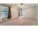 Bedroom with large windows and neutral color paint, ceiling fan and carpeted floors at 245 Sutallee Ridge Ne Ln, White, GA 30184