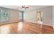 Bedroom features hardwood floors, a ceiling fan, 2 large windows, and an attached bathroom at 245 Sutallee Ridge Ne Ln, White, GA 30184