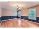 Formal dining room with hardwood floors and elegant lighting, perfect for gatherings at 245 Sutallee Ridge Ne Ln, White, GA 30184