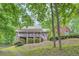 Beautiful two-story brick home with a covered porch and picturesque surroundings at 245 Sutallee Ridge Ne Ln, White, GA 30184