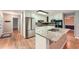 Modern kitchen with stainless steel appliances, granite countertops, and ample cabinet space at 245 Sutallee Ridge Ne Ln, White, GA 30184
